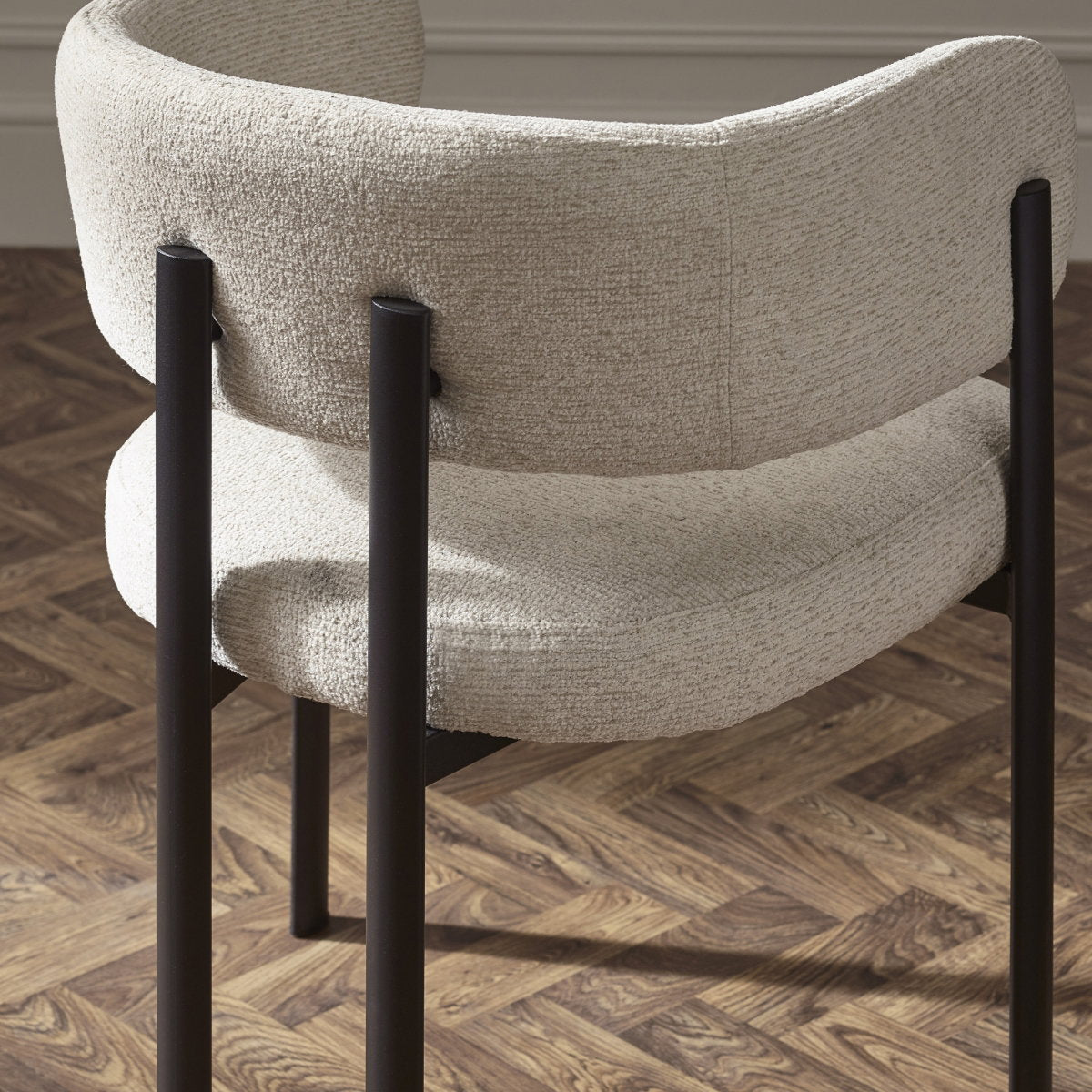 Rear view of Bolivia cream chenille chair showing backrest with metal support