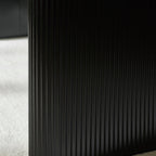 Close-up of black fluted pedestal of Bolivia Oval Dining Table 