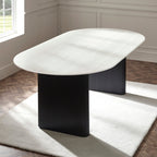 Bolivia white marble effect oval dining table styled on a white rug over parquet wooden flooring
