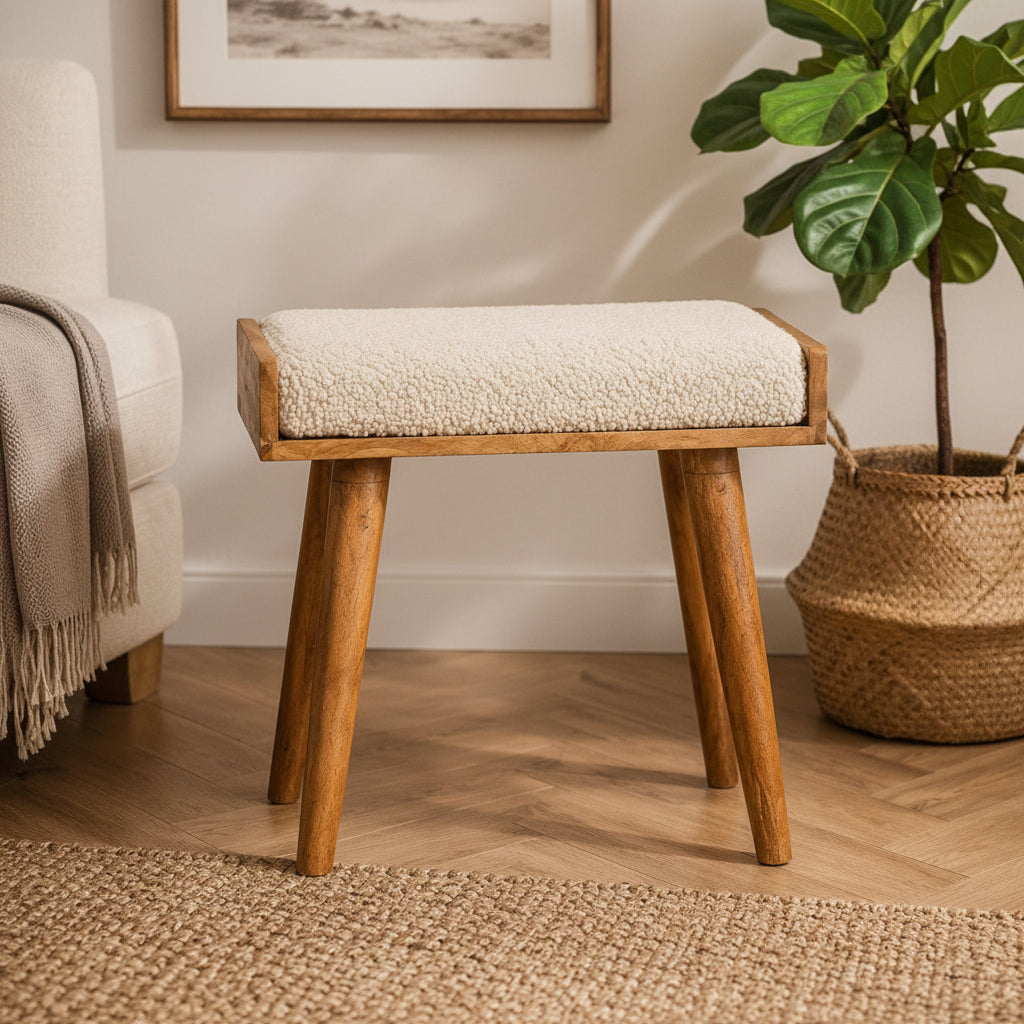 Bouclé Cream Tray-Style Footstool styled in a modern living room setting next to a potted plant.