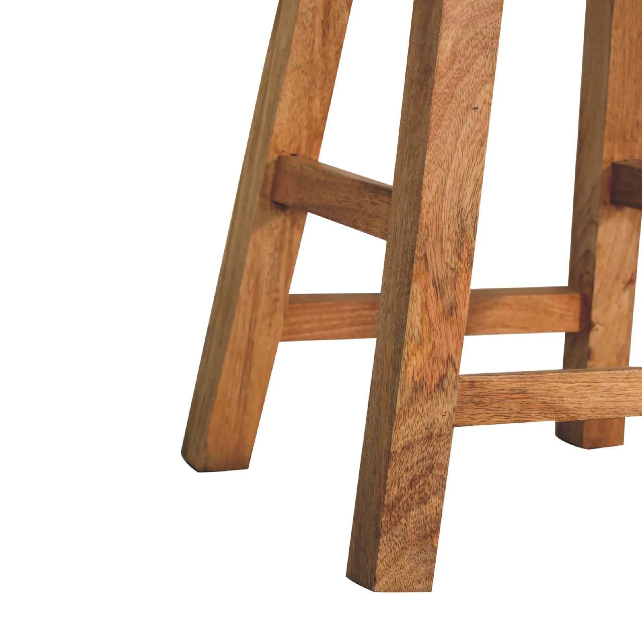 Close-up detail showing the solid mango wood leg joinery and integrated footrest bars.