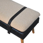Top angle view showing the black leather harness strap contrasting with the bouclé cushion.