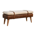 Direct front perspective view of the Bouclé Cream Bench with Brown Leather base and straps.