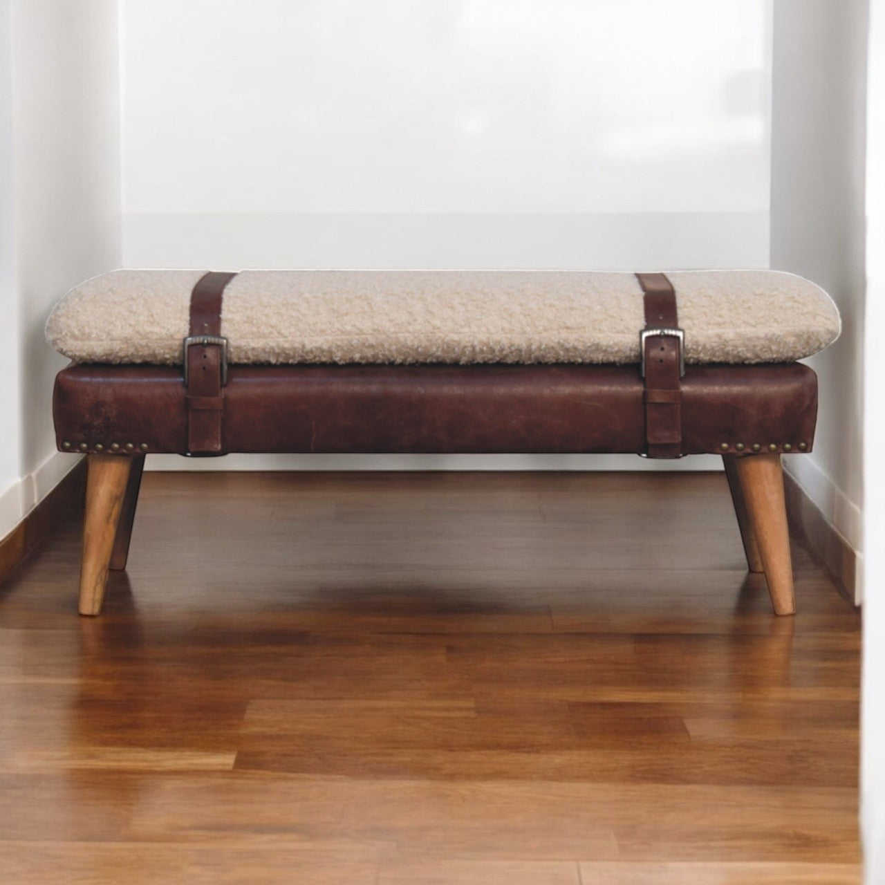 Bouclé Cream and Mahogany Leather Belted Bench styled against a neutral wall.