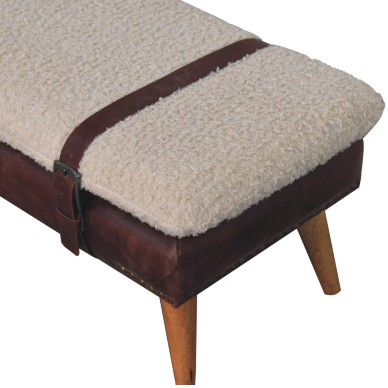 Top perspective showing the rich mahogany leather contrast against the cream bouclé cushion.