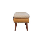 End profile view showing the compact width and splayed leg stance of the tan leather bench.
