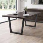 Angled lifestyle view of the Brooklyn dark oak dining table featuring a black powder-coated frame.