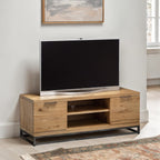 Brooklyn oak industrial TV unit with widescreen television styled in a modern living room setting