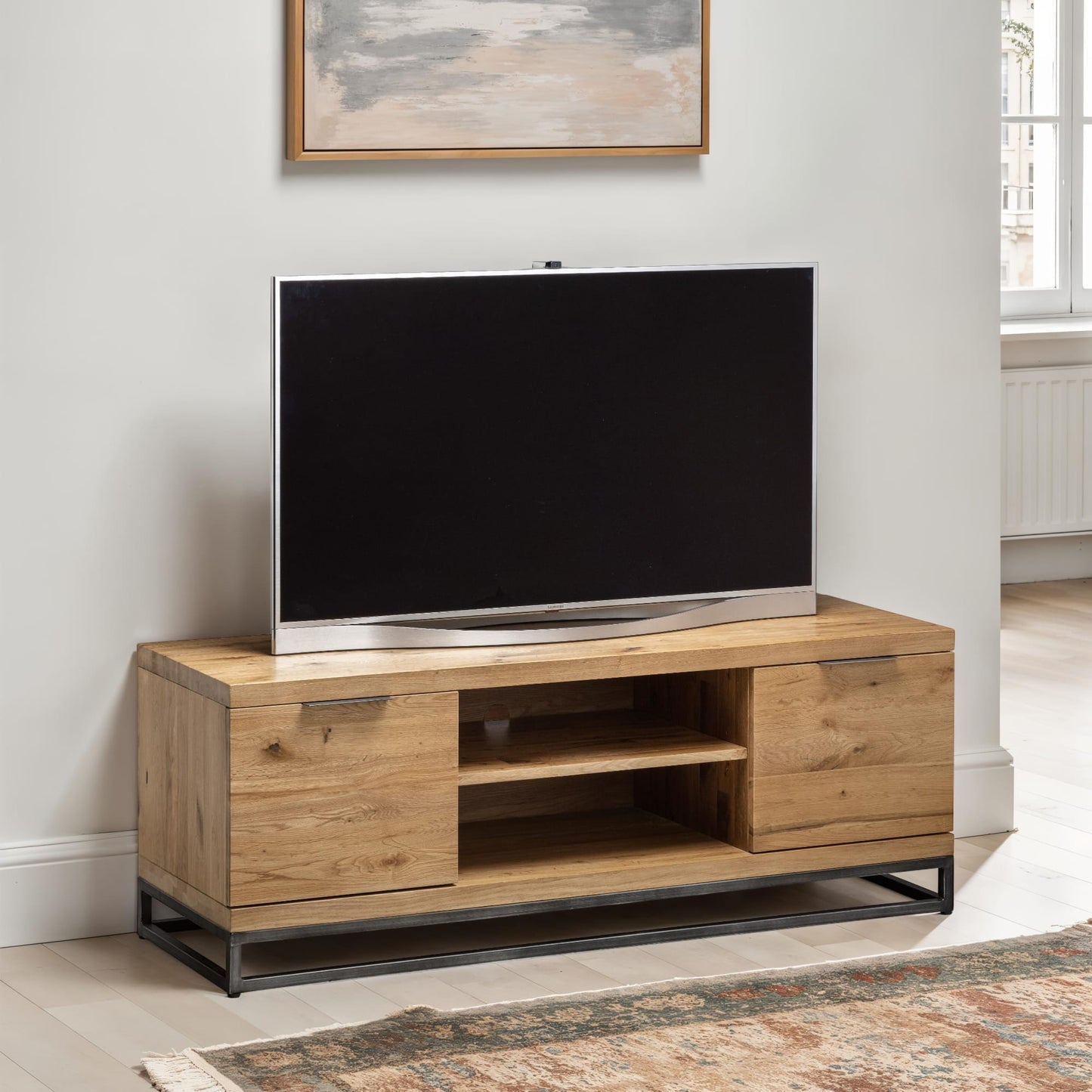 Brooklyn oak industrial TV unit with widescreen television styled in a modern living room setting