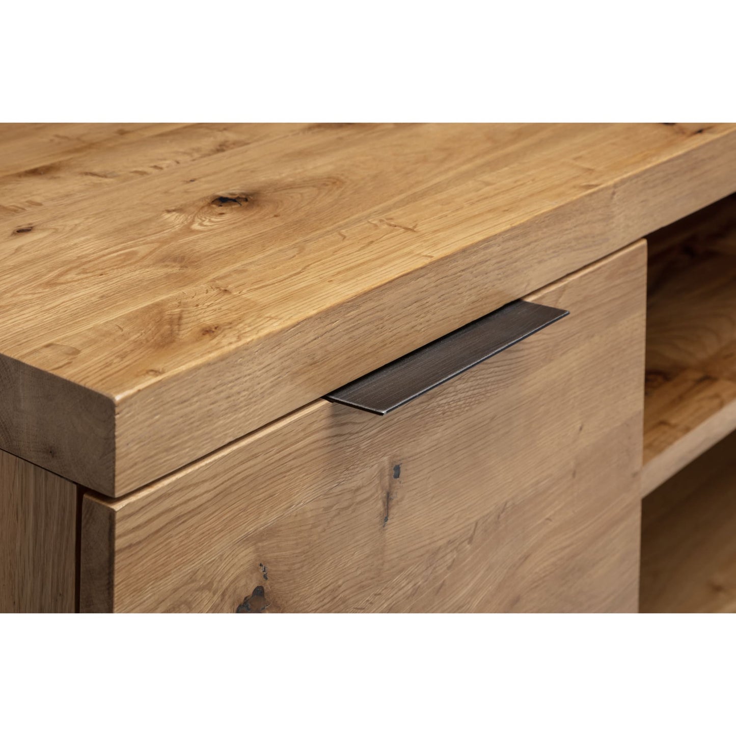 Close-up studio view showing the natural solid oak wood grain and black metal door handle