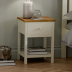 Coxmoor 1 drawer bedside table in painted ivory with classic oak top styled in a bedroom setting.