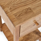 Close-up view of the front corner joint and drawer profile on the Coxmoor oak nightstand.