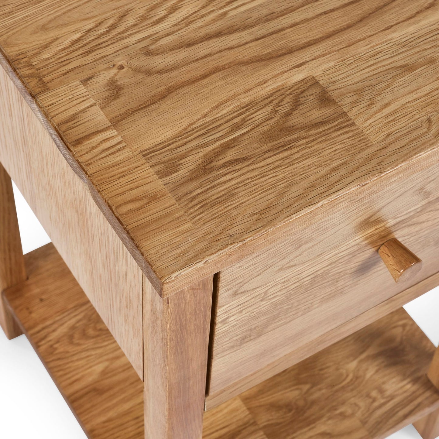 Close-up view of the front corner joint and drawer profile on the Coxmoor oak nightstand.