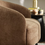 Close-up view of the front corner and texture of the rust brown Dahlia accent chair