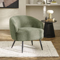 Dahlia curved barrel accent chair in olive green textured faux linen fabric with black metal legs, styled in a modern living room
