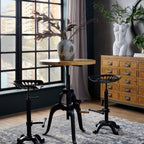 Draftsman industrial adjustable bar table and two tractor seat stools set styled in a modern loft dining room by a window