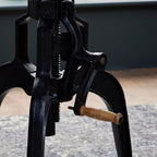 Detailed shot of the black cast iron hand-crank screw mechanism for adjusting the height of the Draftsman table