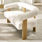 Side angle view of the Freya 2 seater sofa showing curved armrests and seat cushions