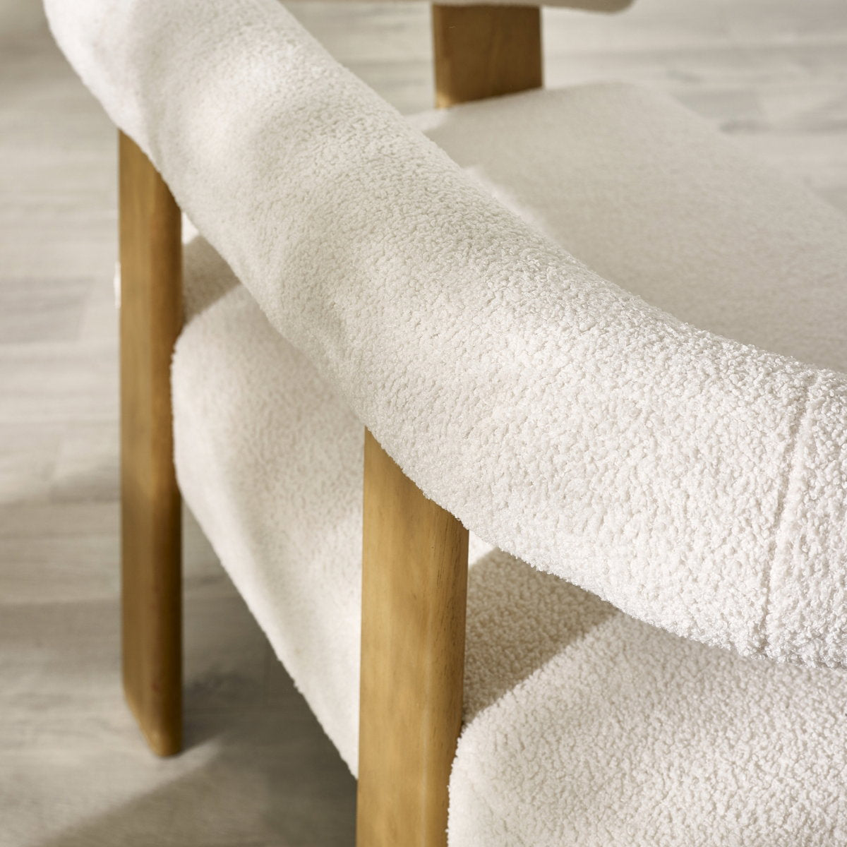 Close-up detail of the durable neutral fabric and plush cushion stitching on the Freya sofa