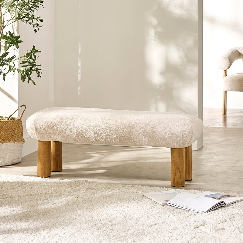 Freya low accent bench styled in a modern room foyer with wall decor