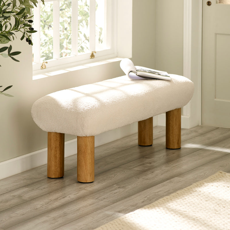 Freya upholstered low hallway bench in neutral fabric with wooden legs angled view featured in hallway