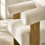 Close-up detail of Freya accent chair arm rest sitting on top of wooden frame