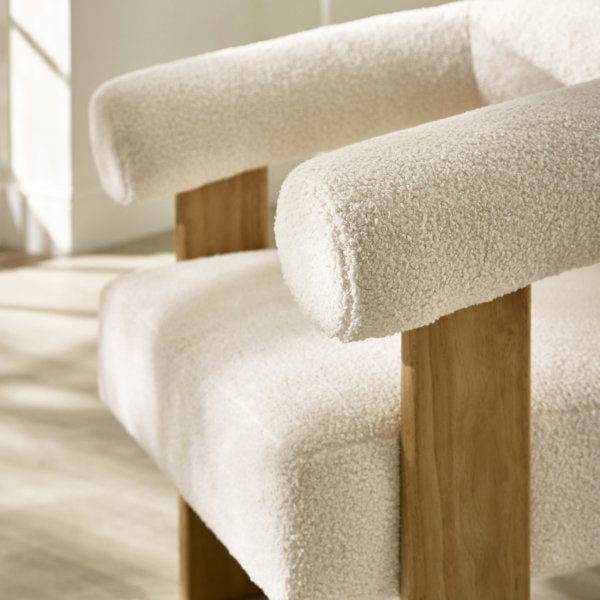 Close-up detail of Freya accent chair arm rest sitting on top of wooden frame