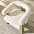 Top view of Freya accent chair in contrast of the gray flooring in a bright room