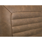 Close-up of the channel-stitched vintage brown faux leather backrest upholstery.