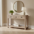 Haldon wooden 3 drawer console table styled in an entryway with a table lamp, potted plant, round mirror, and books on the lower shelf