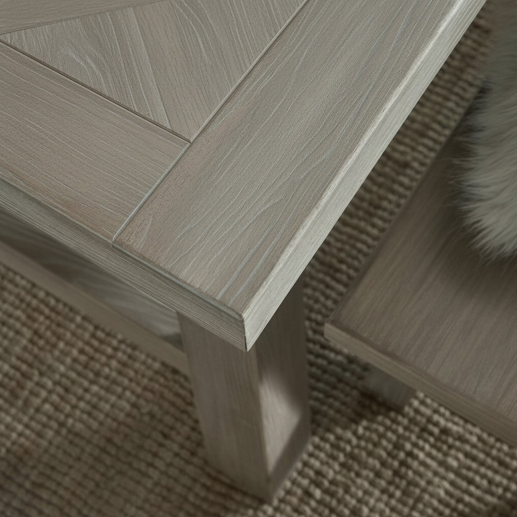 Close-up shot highlighting the geometric parquetry wood detail and corner craftsmanship on the Haldon dining tabletop