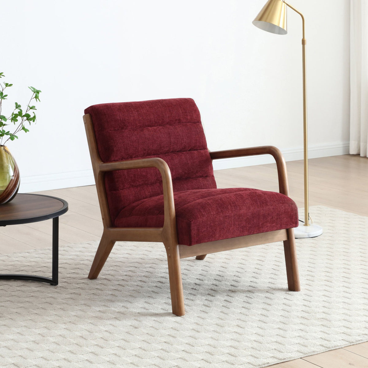 Inca ribbed accent chair in wine chenille fabric with solid walnut frame set in a living room