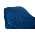 Upper section of the Kahlo blue velvet curved backrest showing channel-tufted fabric texture.