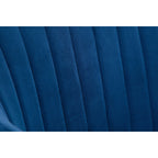 Close-up view of the vertical channel stitching on the plush blue velvet backrest.