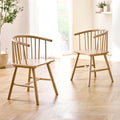 Pair of Kaito oak wooden spindle dining chairs styled in a bright, modern Scandinavian dining room