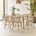 Kaito oak wooden spindle dining chairs arranged around a matching wooden dining table