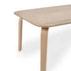 Front perspective studio shot of the Kaito oak wooden dining bench showcasing curved bentwood legs