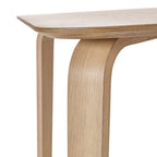 Detailed studio view highlighting the seamless bentwood leg joint on the Kaito oak wooden dining table
