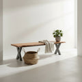 View of the live edge solid acacia wooden foyer bench with industrial grey x-frame legs in a bright corner