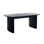 Front view showing the closed oval top and twin black fluted pedestal bases of the Louis extending dining table