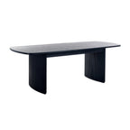 Front view displaying the Louis black fluted dining table fully extended with the center leaf insert