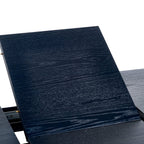 Close-up shot of the dark wood grain extension leaf being inserted into the Louis dining table top