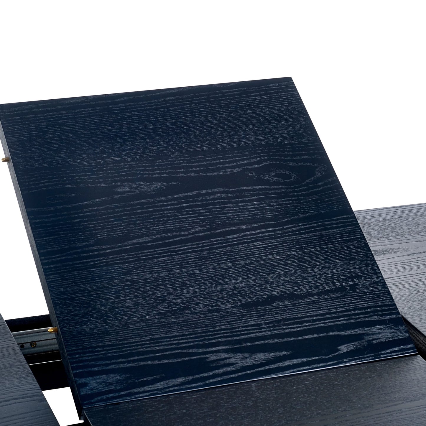 Close-up shot of the dark wood grain extension leaf being inserted into the Louis dining table top