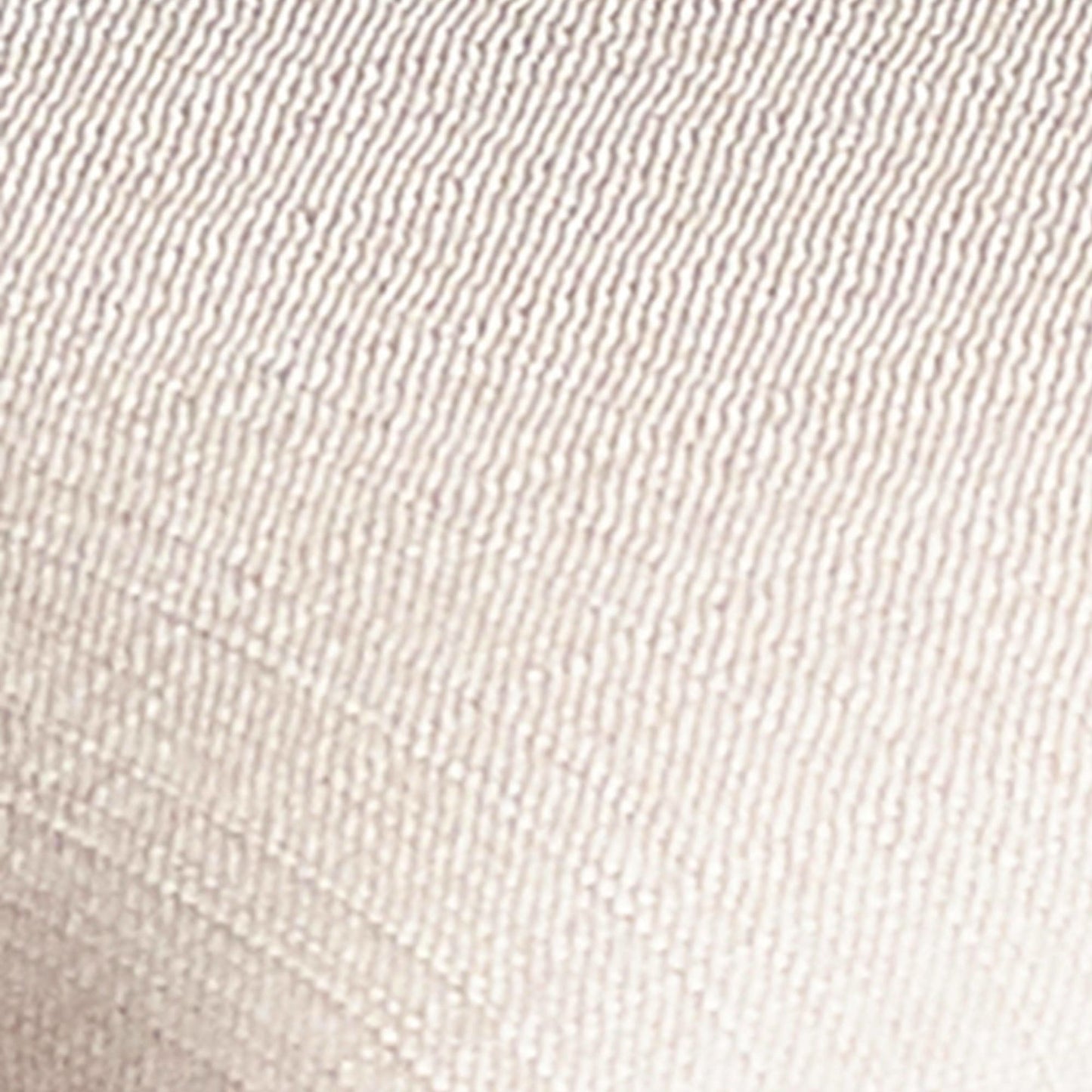 Macro detail shot of the neutral woven fabric texture on the Lowry dining chair seat cushion