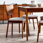 Set of 2 Lowry dining chairs in exquisite cherry ash veneer styled around a dining table in a modern home
