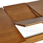 Close-up view of the internal butterfly extension leaf unfolding from inside the Lowry dining table frame