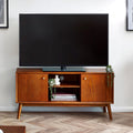 Lowry TV media unit in exquisite cherry ash veneer styled with a flat screen television in a living room