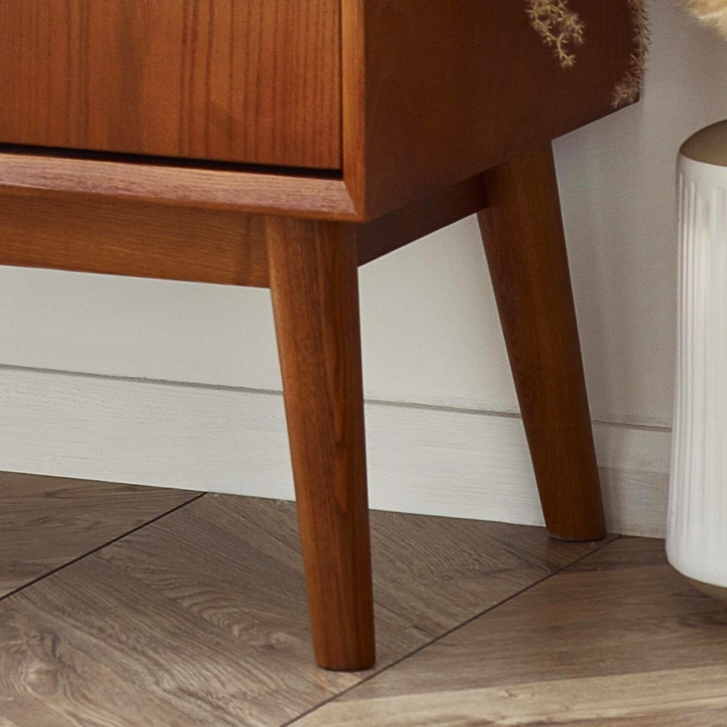 Close-up shot of the splayed tapered wooden leg frame supporting the Lowry small sideboard