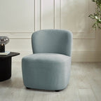 Lunetta Riviera Blue Chenille Accent Chair styled in a modern living room setting.