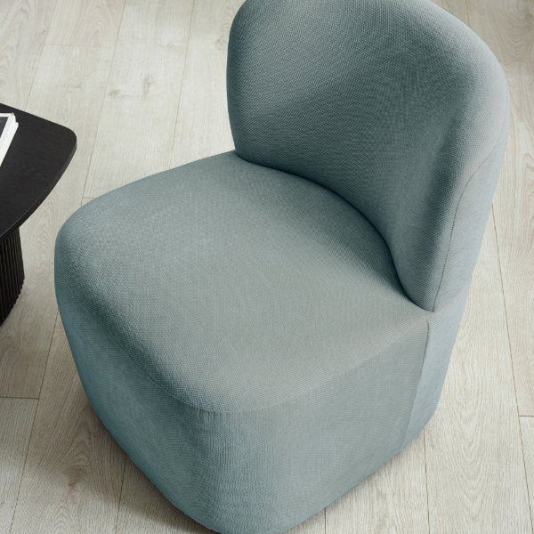 Macro texture shot showing the soft-touch riviera blue chenille woven fabric on the Lunetta Chair.